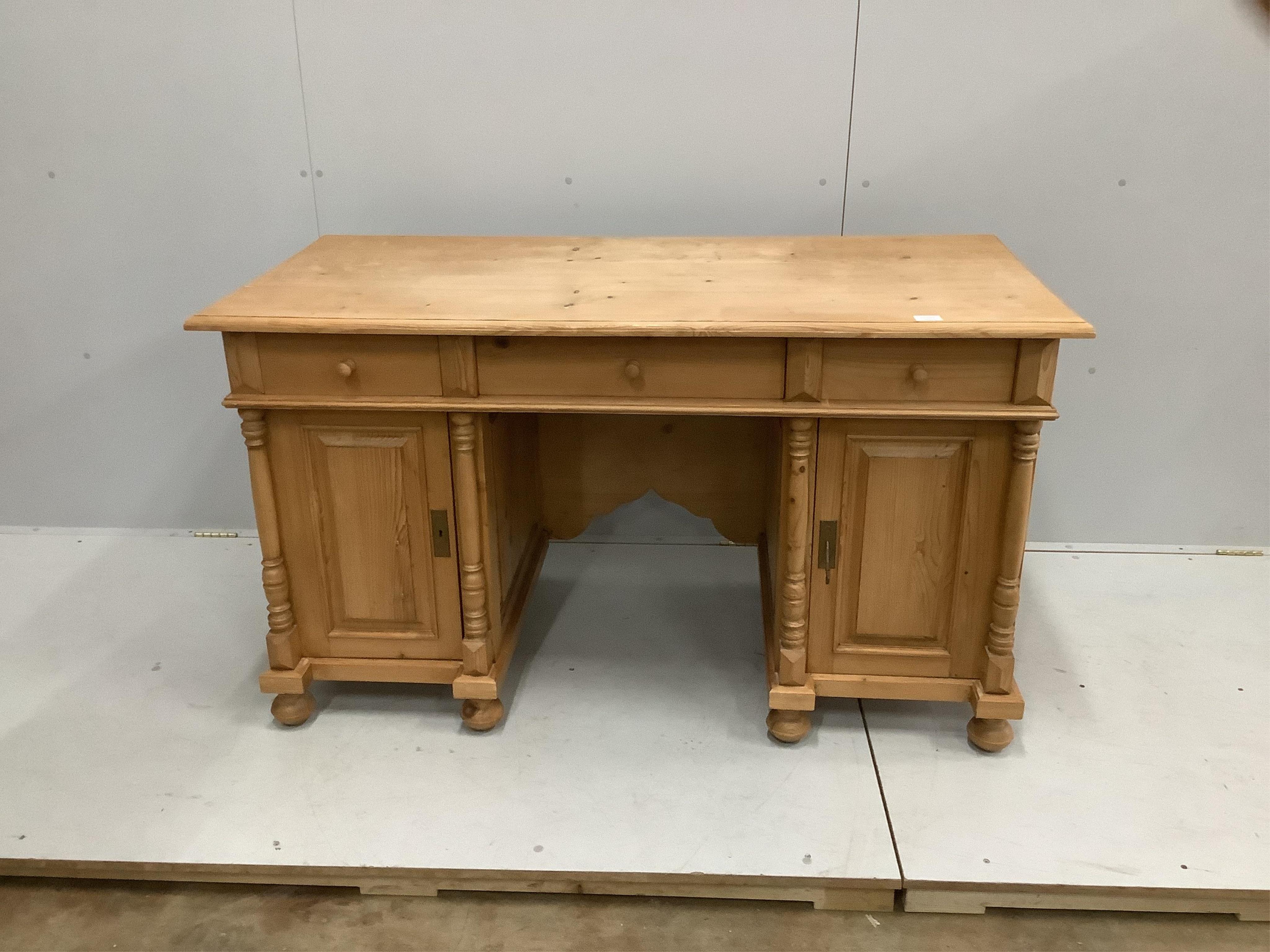 A Continental stripped pine kneehole desk, width 154cm, depth 68cm, height 82cm. Condition - good